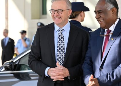 The prime ministers of Australia and Vanuatu stand together after signing the Nakamal Agreement in Canberra.