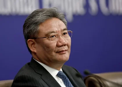 Officials seated at a bilateral economic and trade meeting between China and the Netherlands.