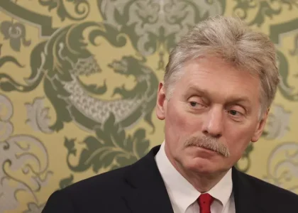 Kremlin spokesman Dmitri Peskov speaking during a press briefing, or an exterior view of the Kremlin in Moscow.