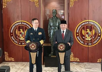 Chinese and Indonesian foreign and defense officials meet around a conference table.