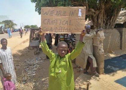 Residents gathered near homes in a rural community in northwestern Nigeria after an armed attack.