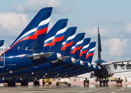 Russian-made passenger aircraft and helicopters on an aviation production apron.