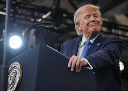 US President Donald Trump speaking at a lectern during an event in New York.