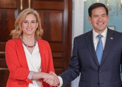 The United States and Austrian foreign ministers walking into a meeting room in Washington.