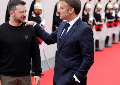 Emmanuel Macron and Volodymyr Zelenskyy meet during an official ceremony in Paris.