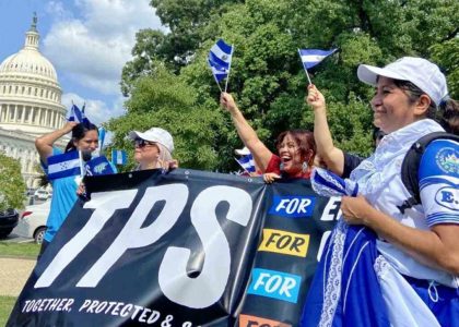 Salvadoran immigrants and supporters gathering in the United States during an event concerning temporary protected status.