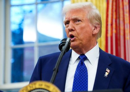 US President Donald Trump speaking to journalists before boarding Air Force One.