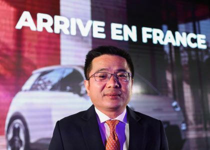 GAC Group executives present electric vehicles at a Paris event before the motor show.